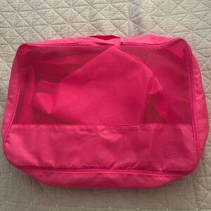 Hot pink packing cubes.